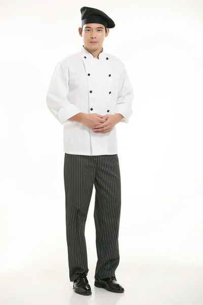 穿着各种服装的厨师在白种人的背景面前 — 图库照片