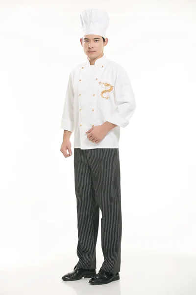 Vestindo todos os tipos de roupas chef nutricionista na frente de fundo branco — Fotografia de Stock