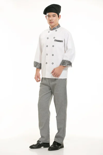 Indossare tutti i tipi di abbigliamento chef dietista di fronte a sfondo bianco Foto Stock