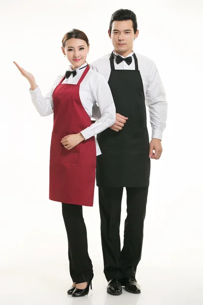Nosić wszelkiego rodzaju fartuch kelner stojący w białym tle — Zdjęcie stockowe