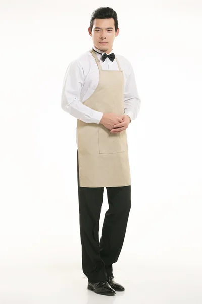 Wear all sorts of apron waiter standing in white background — Stock Photo, Image