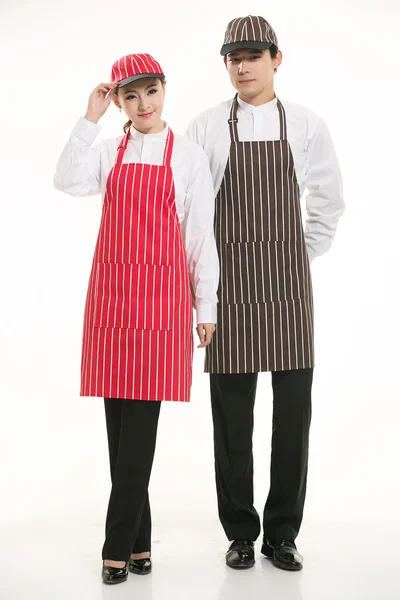 Indossare tutti i tipi di grembiule cameriere in piedi su sfondo bianco — Foto Stock