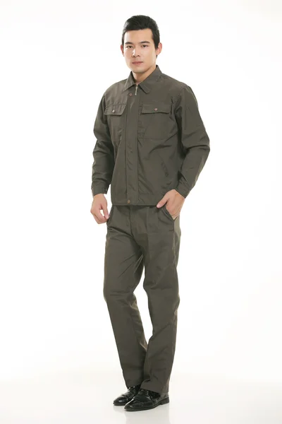 The young engineer various occupation clothing standing in front of a white background — Stock Photo, Image