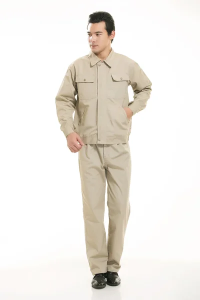 The young engineer various occupation clothing standing in front of a white background — Stock Photo, Image