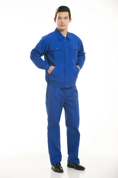 The young engineer various occupation clothing standing in front of a white background — Stock Photo, Image