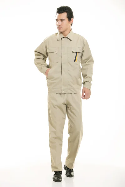 The young engineer various occupation clothing standing in front of a white background — Stock Photo, Image