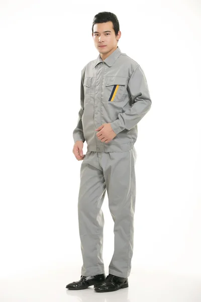 The young engineer various occupation clothing standing in front of a white background — Stock Photo, Image