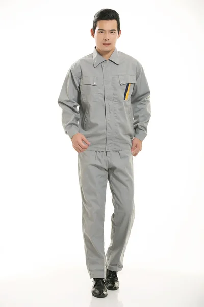 The young engineer various occupation clothing standing in front of a white background — Stock Photo, Image