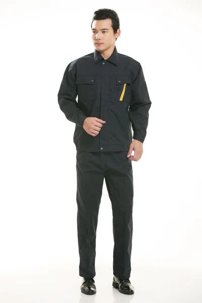 The young engineer various occupation clothing standing in front of a white background — Stock Photo, Image