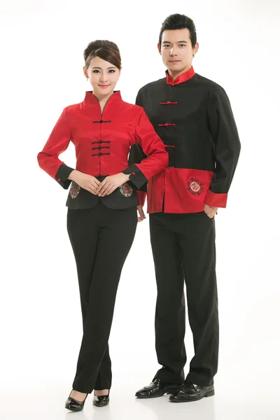 Indossare cameriere abbigliamento cinese di fronte a uno sfondo bianco Foto Stock Royalty Free
