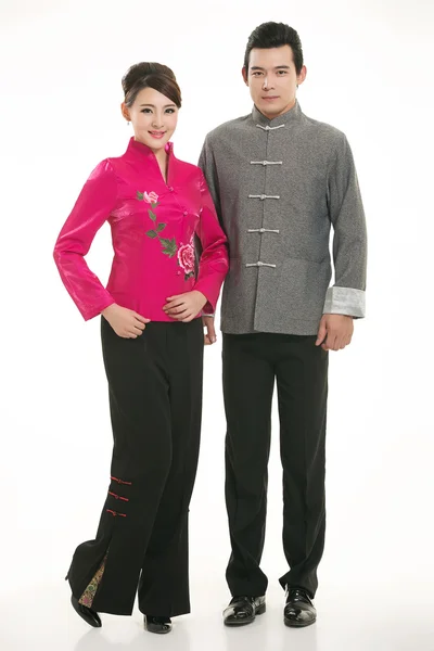 Indossare cameriere abbigliamento cinese di fronte a uno sfondo bianco Immagini Stock Royalty Free