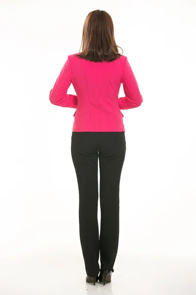 Beyaz arka plan önünde takım elbise giyen genç Asyalı kadınlar.