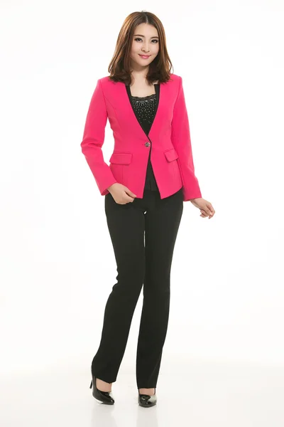 Young Asian women wearing a suit in front of a white background — Stock Photo, Image