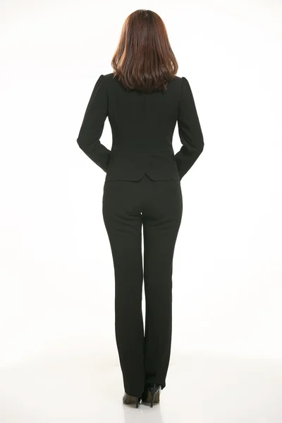 Young Asian women wearing a suit in front of a white background — Stock Photo, Image