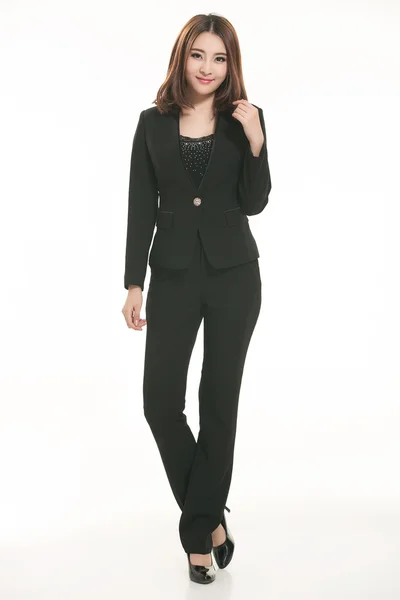 Young Asian women wearing a suit in front of a white background — Stock Photo, Image