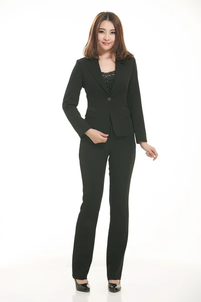 Young Asian women wearing a suit in front of a white background — Stock Photo, Image