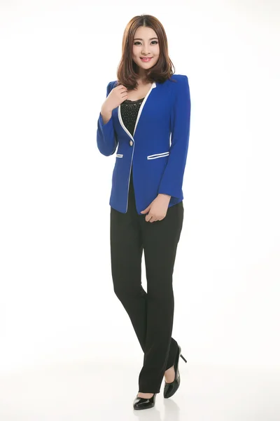 Young Asian women wearing a suit in front of a white background — Stock Photo, Image