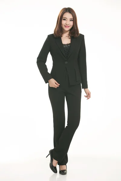 Young Asian women wearing a suit in front of a white background — Stock Photo, Image