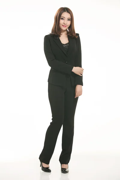 Young Asian women wearing a suit in front of a white background — Stock Photo, Image