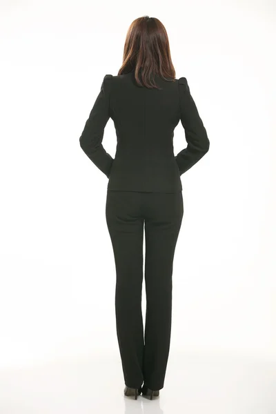 Young Asian women wearing a suit in front of a white background — Stock Photo, Image