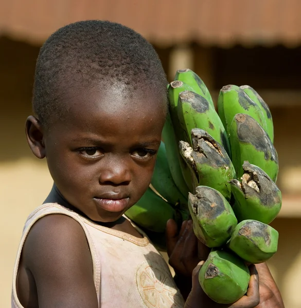 Portrait of little boy with bananas — Stock Photo, Image