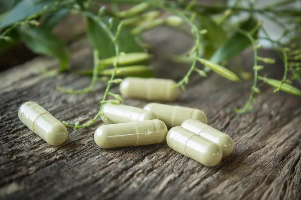 Herbal medicine in capsules — Stock Photo, Image