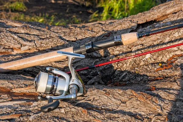 Fishing rod and reel on the natural background. — Stock Photo, Image