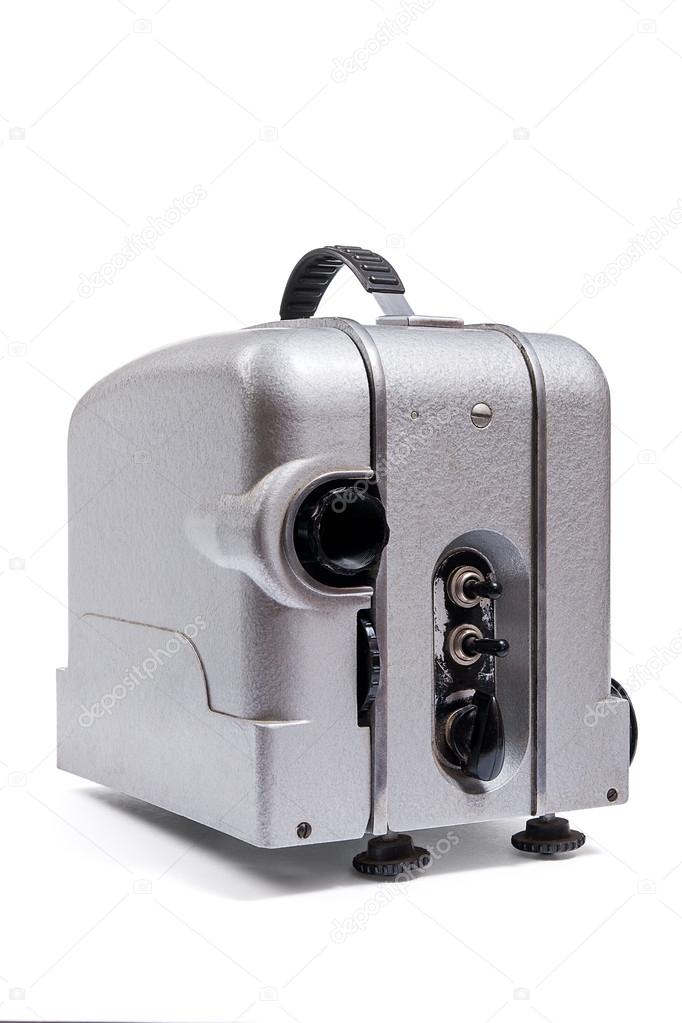 Vintage motion picture film projector isolated on a white backgr