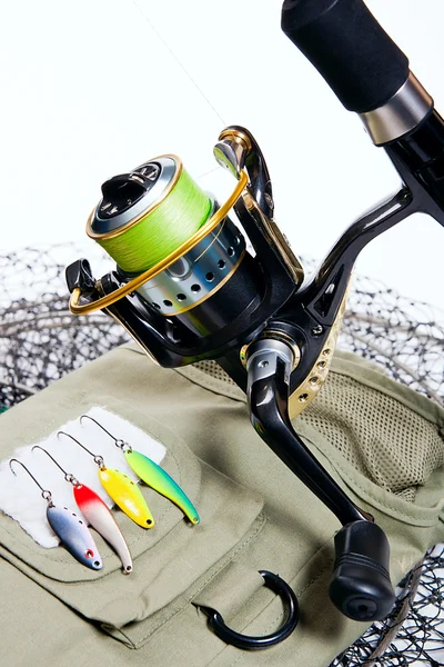 Fishing rod and lures on white. — Stock Photo, Image