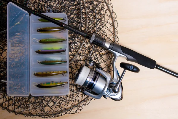 Fishing rod and reel with box for baits. — Stock Photo, Image