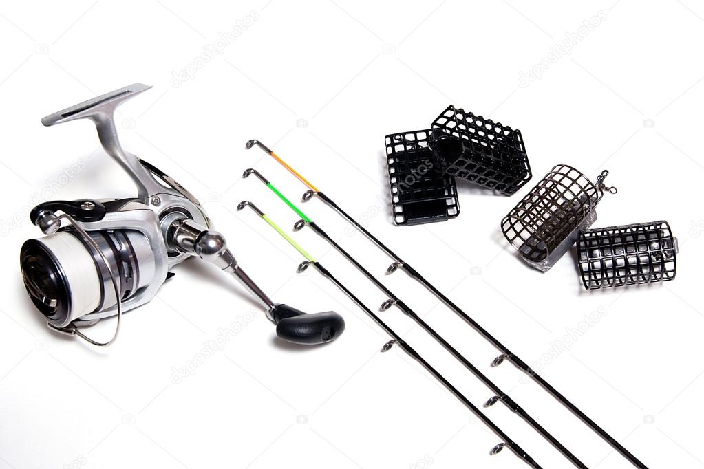 Fishing feeder and reel with accessories on white background Stock