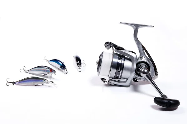 Fishing reel with plastic fishing baits. — Stock Photo, Image