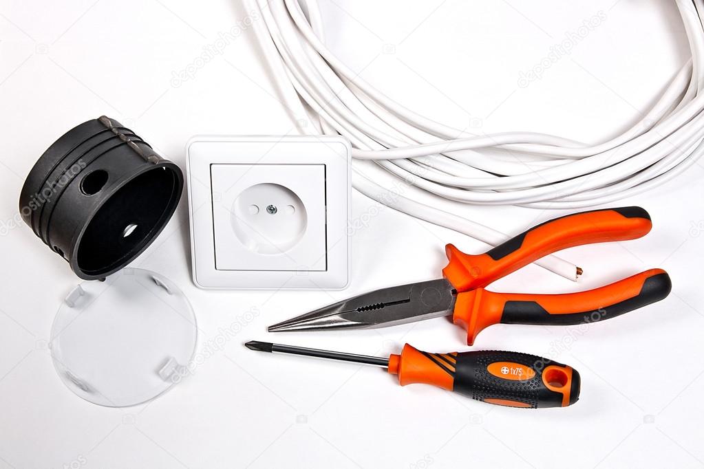 Electrician tools, cable, box for installation of sockets and wa
