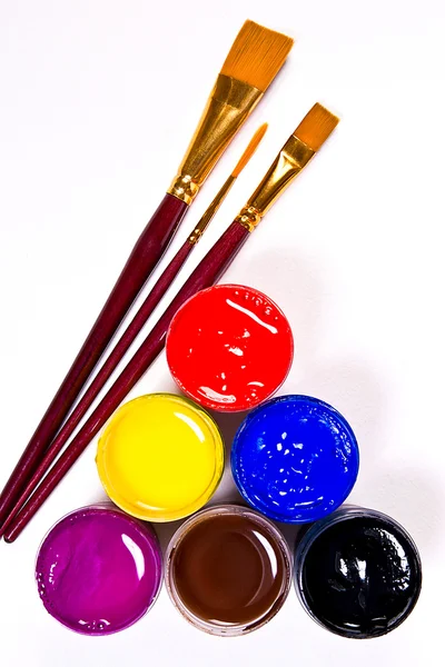 Bottles with gouache paints and brushes for artistic paintings. — Stock Photo, Image