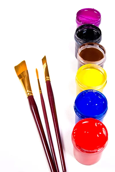 Bottles with gouache paints and brushes for artistic paintings. — Stock Photo, Image