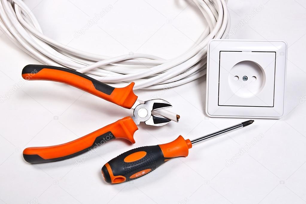 Electrician tools, cable and wall socket