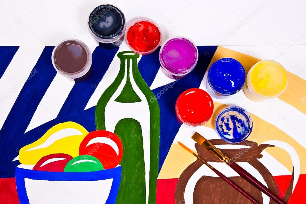 Bottles with gouache paints and brushes for artistic paintings.