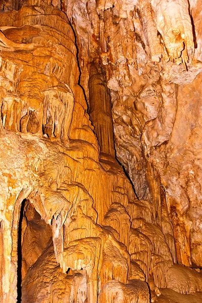 Limestone formations on the wall of an underground cave. — Stock Photo, Image