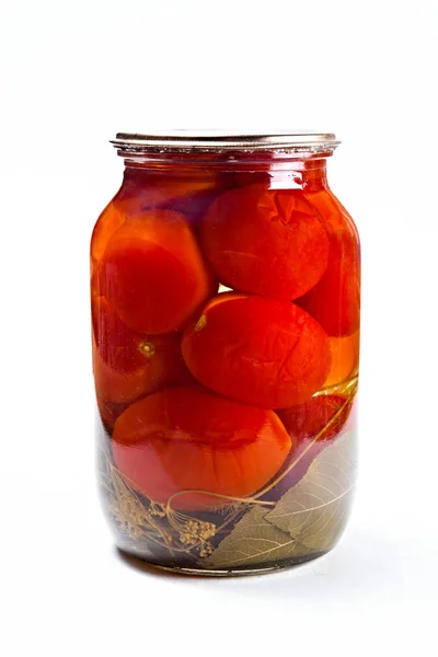 Glass jar of canned tomatoes on white background. — Stock Photo, Image