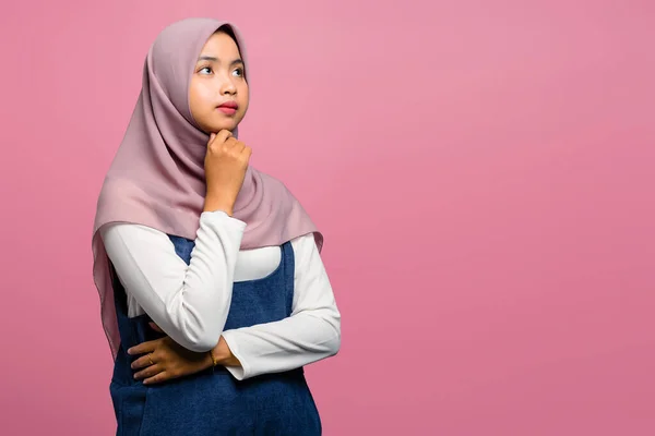 Young asian woman thinking and wearing hijab