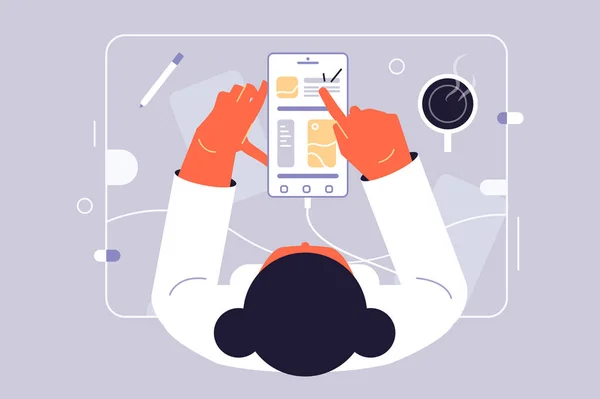 Kadın telefondaki masaya bakar.