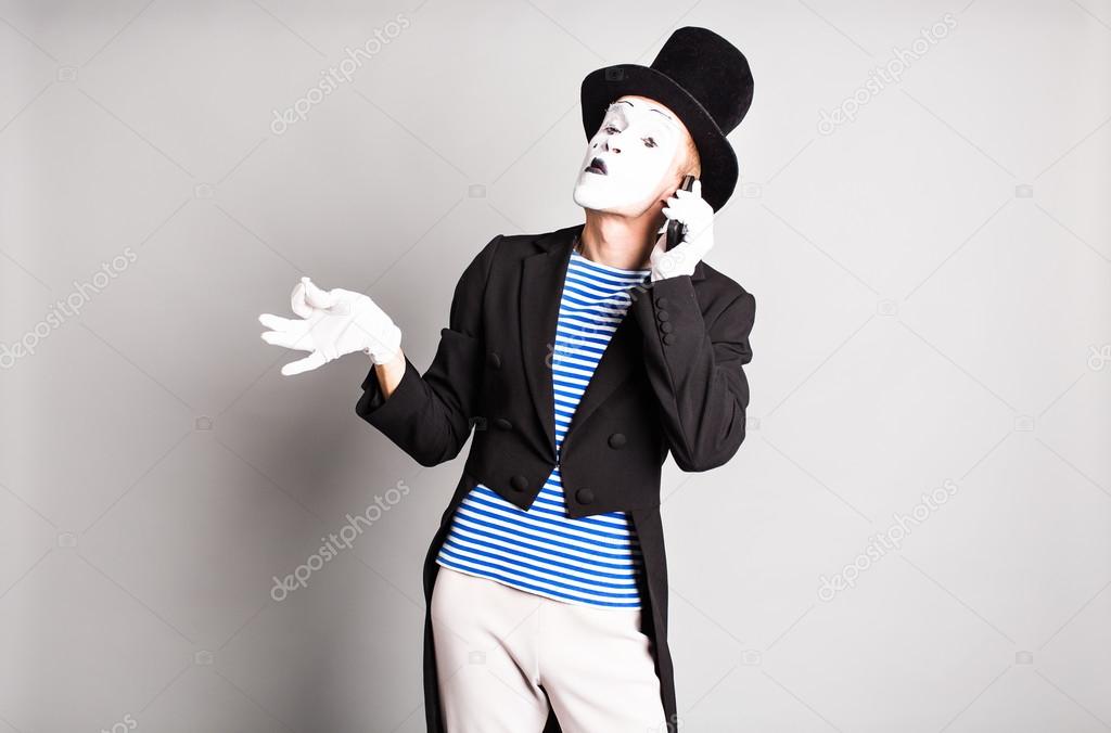 Man mime  talking on his cell phone. April Fools Day concept.