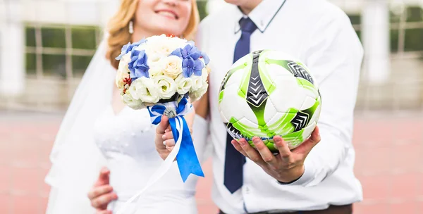European Football Championship concept. Wedding couple on the football stadium. — Stock Photo, Image