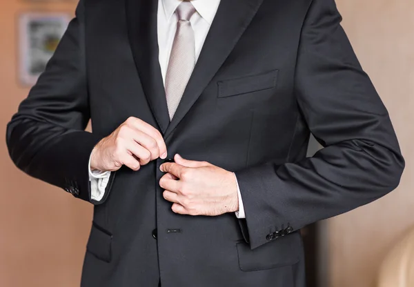 Man buttoning jacket — Stock Photo, Image