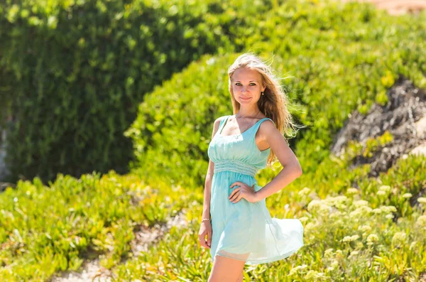 Portrait of blond woman in mint-colored dress outdoor — Stock Photo, Image