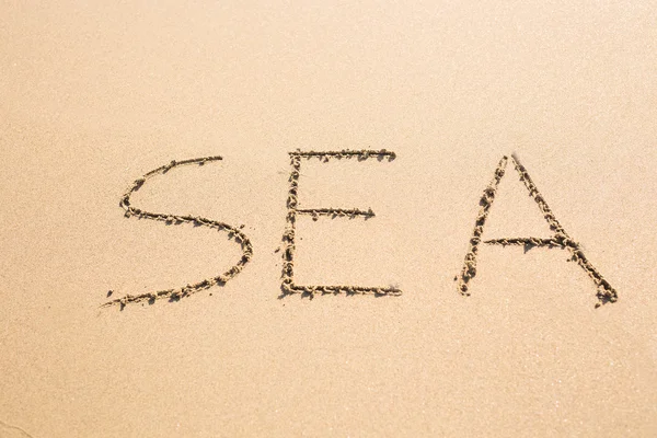 Slovo moře na písku — Stock fotografie