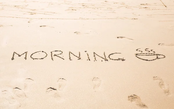 Abstract hand writing on the sand word Morning — Stock Photo, Image