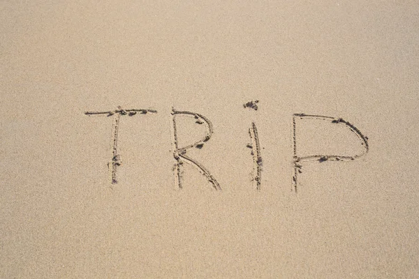 Written words trip on sand of beach — Stock Photo, Image