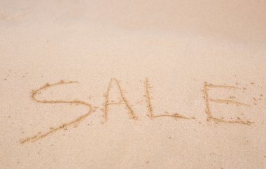 Satılık bir plajda kuma el yazısı