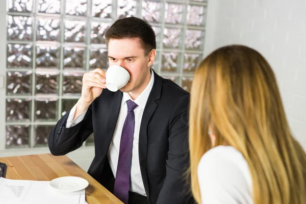 Portrait of handsome successful man drink coffee, businessman having breakfast